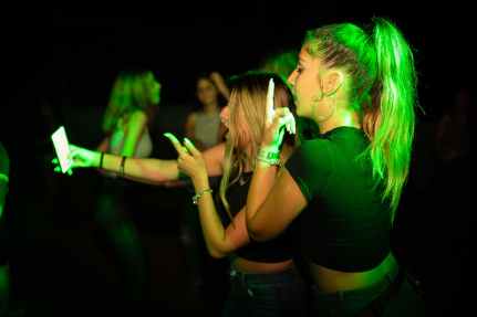 women taking selfie next to each other